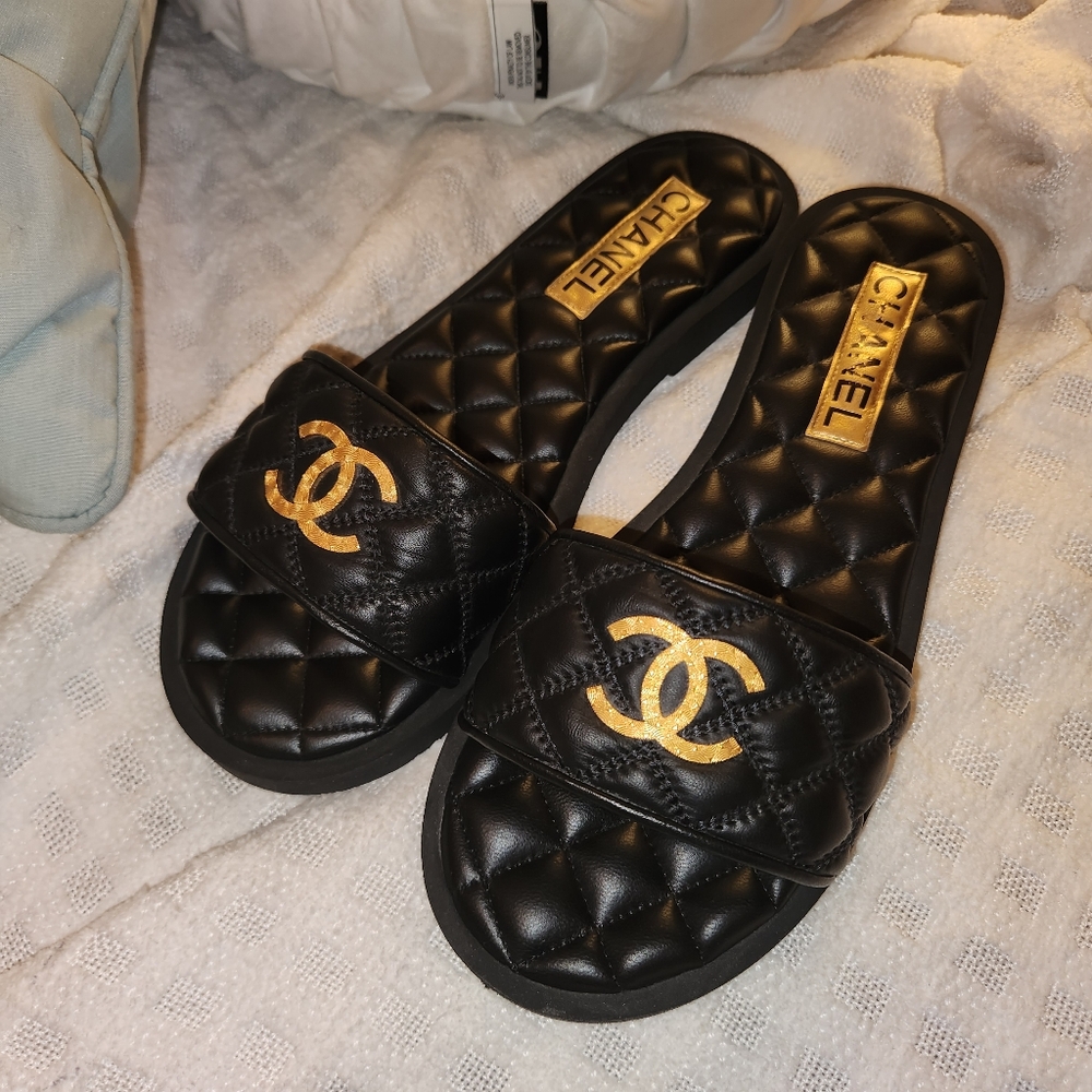 Chanel Black and Gold Quilted Slides
